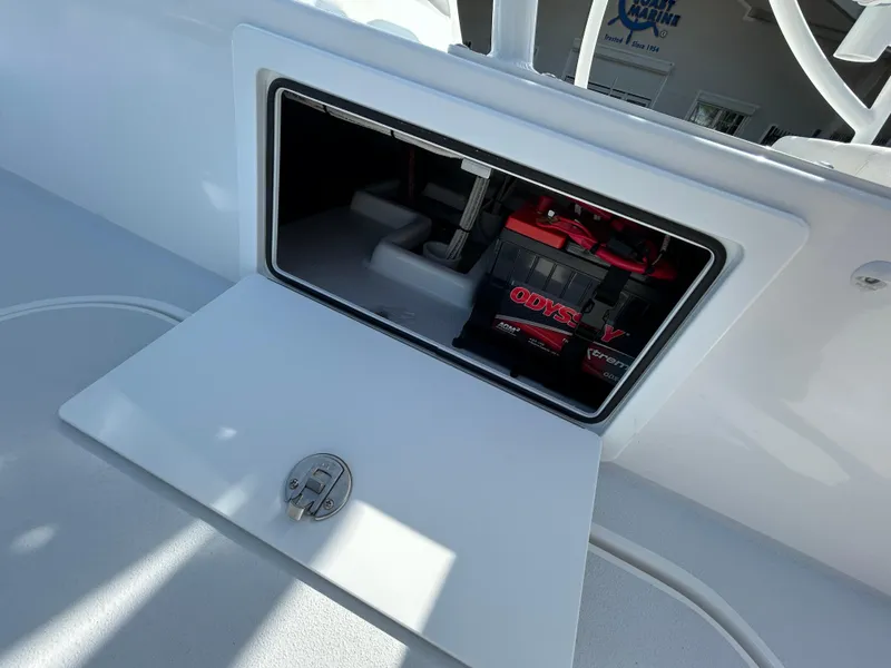 Slide: The Image of 2025 Shallow Sport 25 X3 boat battery compartment with Odyssey battery visible. - 14