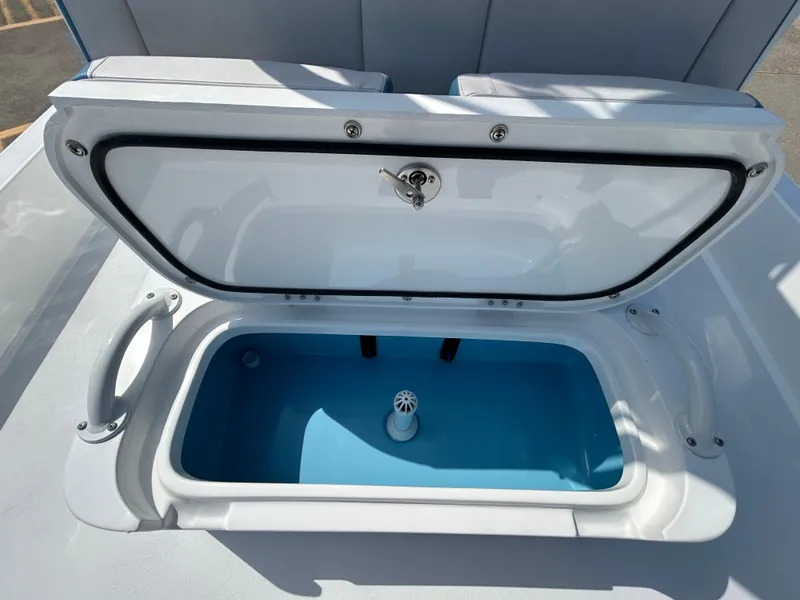 Slide: The Image of Open storage compartment on 2025 Shallow Sport 25 X3 boat. - 23