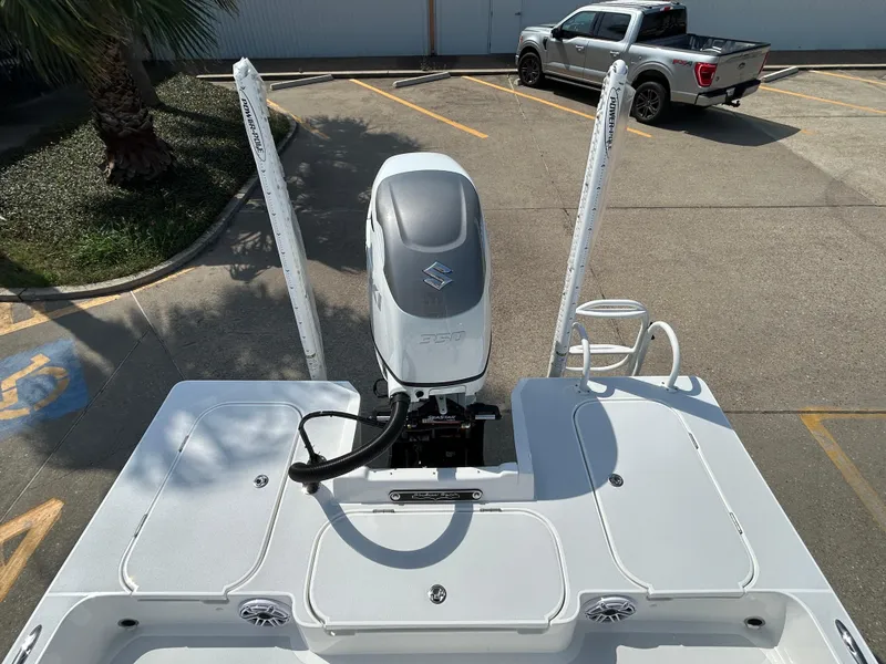 Slide: The Image of 2025 Shallow Sport 25 X3 boat with Suzuki engine in parking lot. - 8