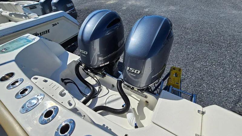 Slide: The Image of 2019 Sailfish 275 DC boat with dual 150 horsepower outboard engines. - 10