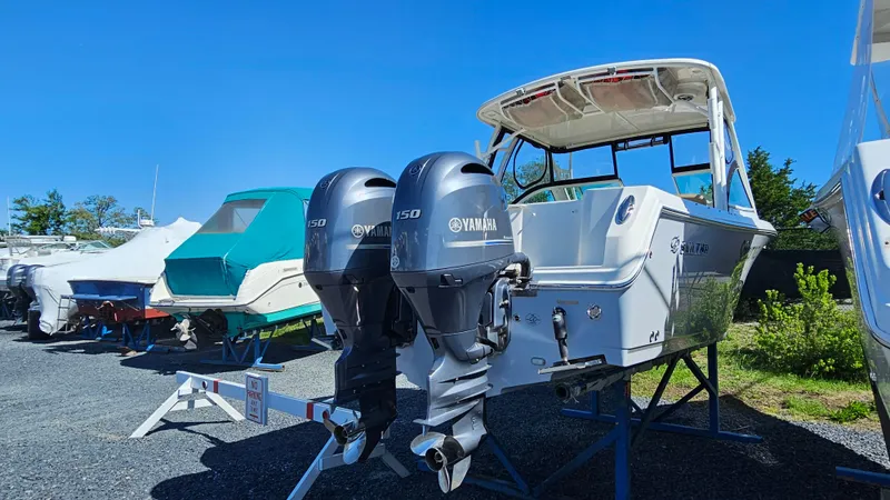 Slide: The Image of 2019 Sailfish 275 DC boat with twin Yamaha outboard motors on display. - 4