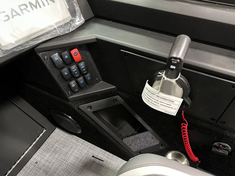 Slide: The Image of 2025 Alumacraft Competitor 175X Sport dashboard with control panel and throttle lever. - 14