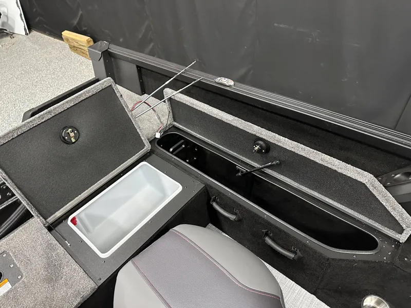 Slide: The Image of 2025 Alumacraft Competitor 175X Sport boat interior storage compartments. - 25