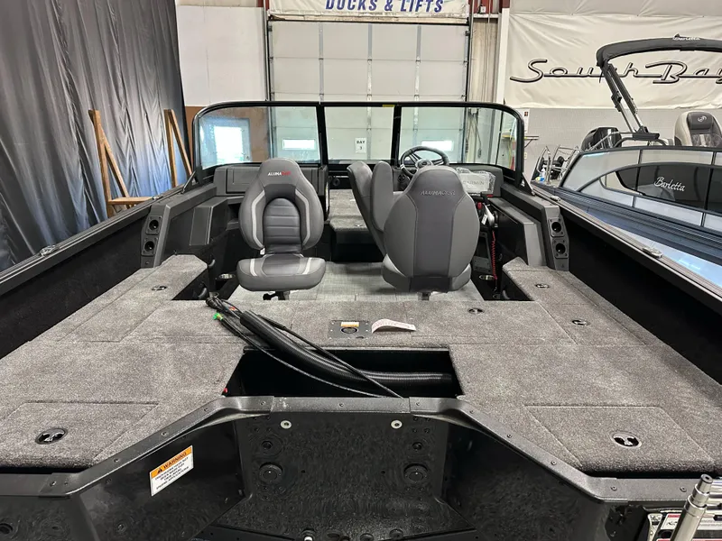 Slide: The Image of 2025 Alumacraft Competitor 175X Sport interior with dual seats and spacious deck. - 28