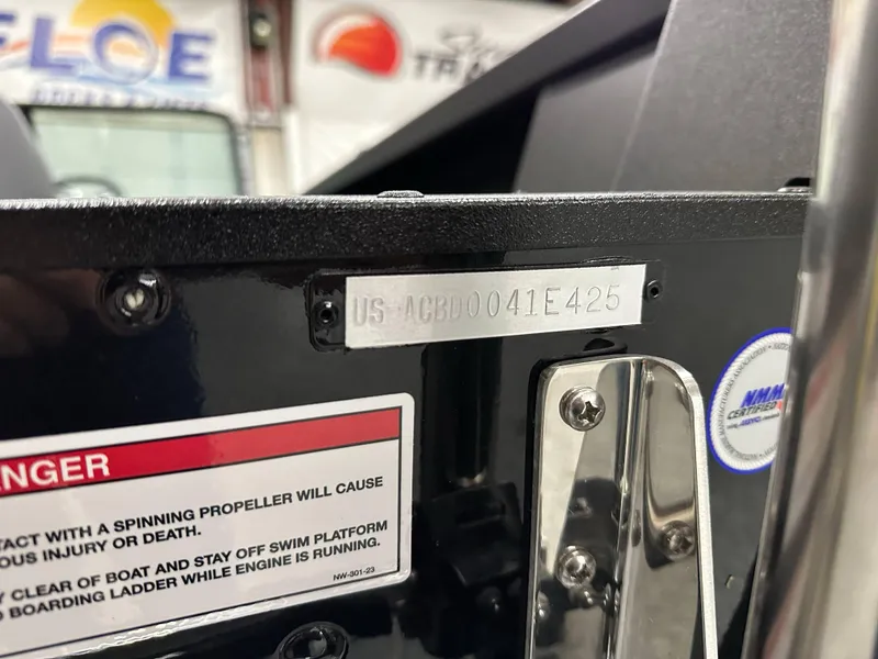 Slide: The Image of 2025 Alumacraft Competitor 175X Sport boat identification plate and safety warning label. - 30