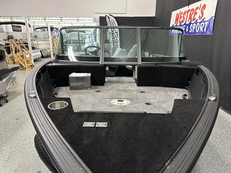 Slide: The Image of 2025 Alumacraft Competitor 175X Sport boat interior at Westre's Marine & Sport showroom. - 4