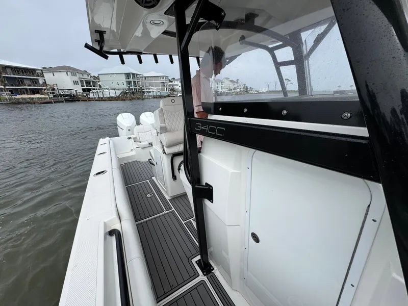 Slide: The Image of 2019 Fountain 34 CC boat on water, featuring sleek design and modern amenities. - 25