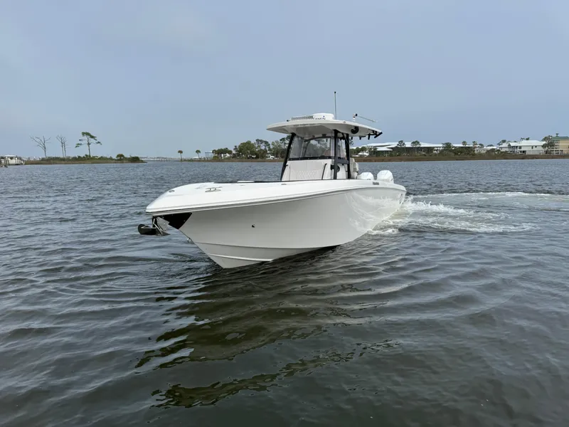 Slide: The Image of 2019 Fountain 34 CC boat cruising on calm waters. - 4