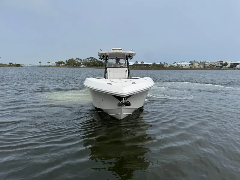 Slide: The Image of 2019 Fountain 34 CC boat on calm water, front view, clear sky background. - 6