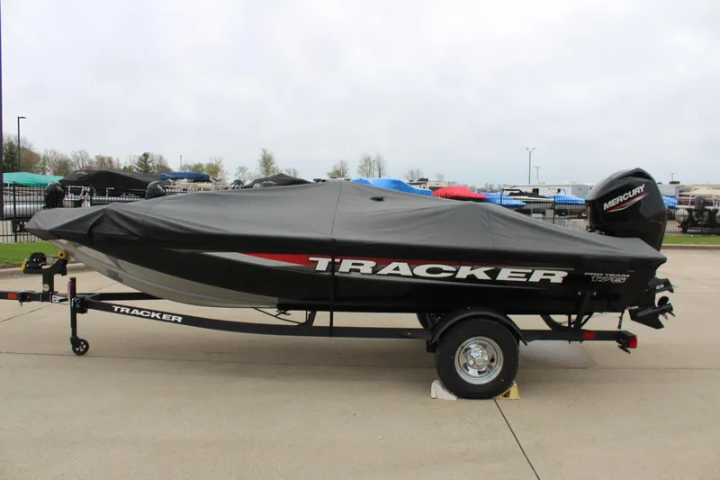 Slide: The Image of 2025 Tracker Pro Team 175 Crappie Edition boat with cover on trailer. - 10