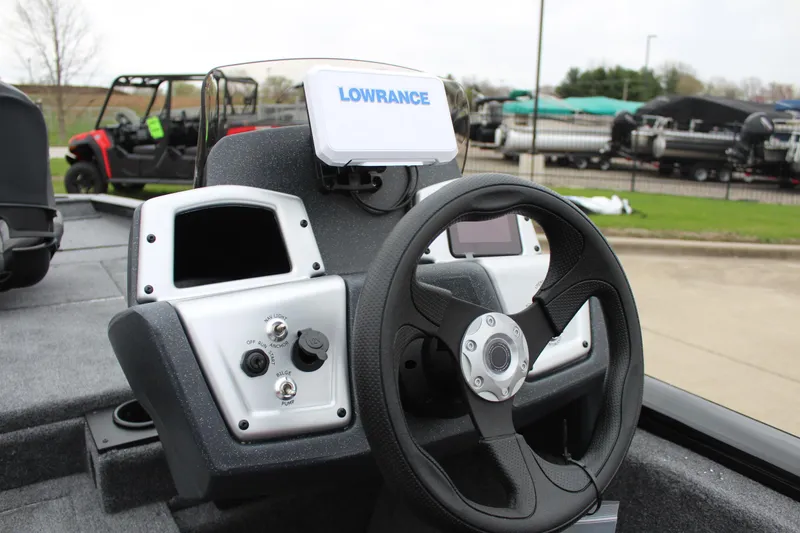 Slide: The Image of 2025 Tracker Pro Team 175 Crappie Edition boat dashboard with Lowrance navigation system. - 13