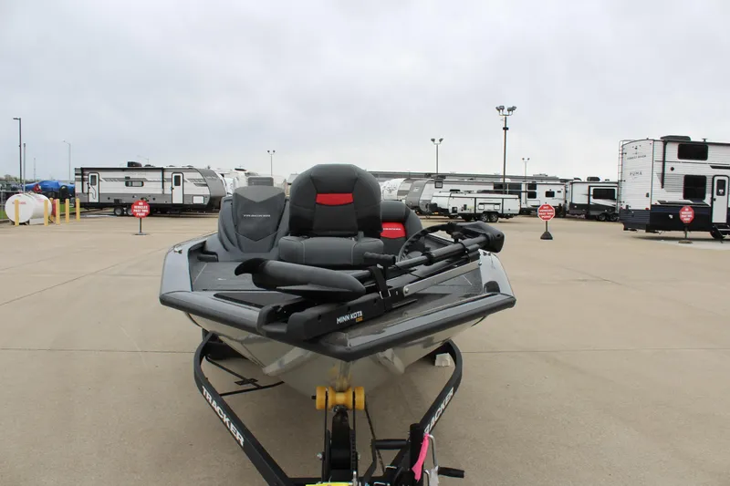 Slide: The Image of 2025 Tracker Pro Team 175 Crappie Edition boat on trailer in parking lot. - 2