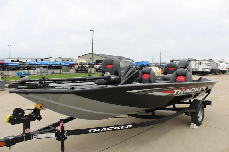 Slide: The Image of 2025 Tracker Pro Team 175 Crappie Edition boat on trailer, parked outdoors. - 3