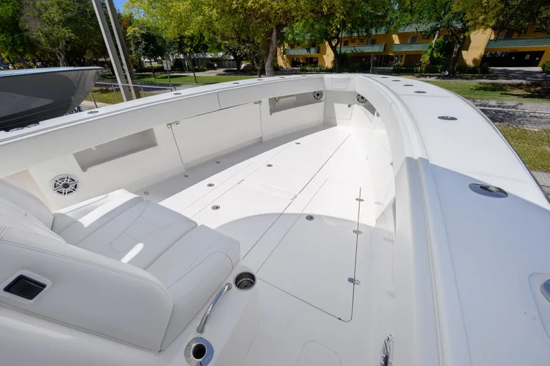 Slide: The Image of 2022 SeaVee 390Z boat deck, spacious and sleek design, white interior, outdoor setting. - 11