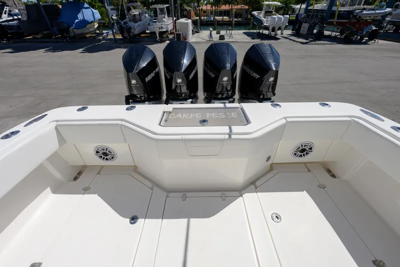 Slide: The Image of 2022 SeaVee 390Z boat with quad outboard engines, spacious deck, and modern design. - 7