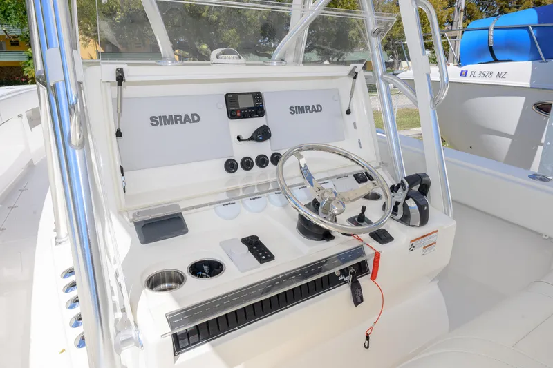 Slide: The Image of 2022 SeaVee 390Z boat console with Simrad electronics and steering wheel. - 9