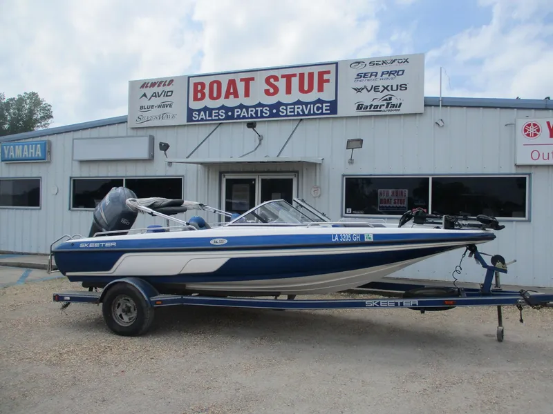 Slide: The Image of 2005 Skeeter SL 190 boat on trailer outside Boat Stuf sales and service shop. - 0