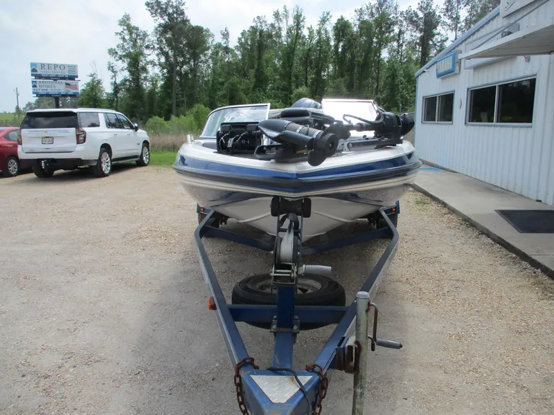 Slide: The Image of 2005 Skeeter SL 190 boat on trailer, parked outside dealership. - 2