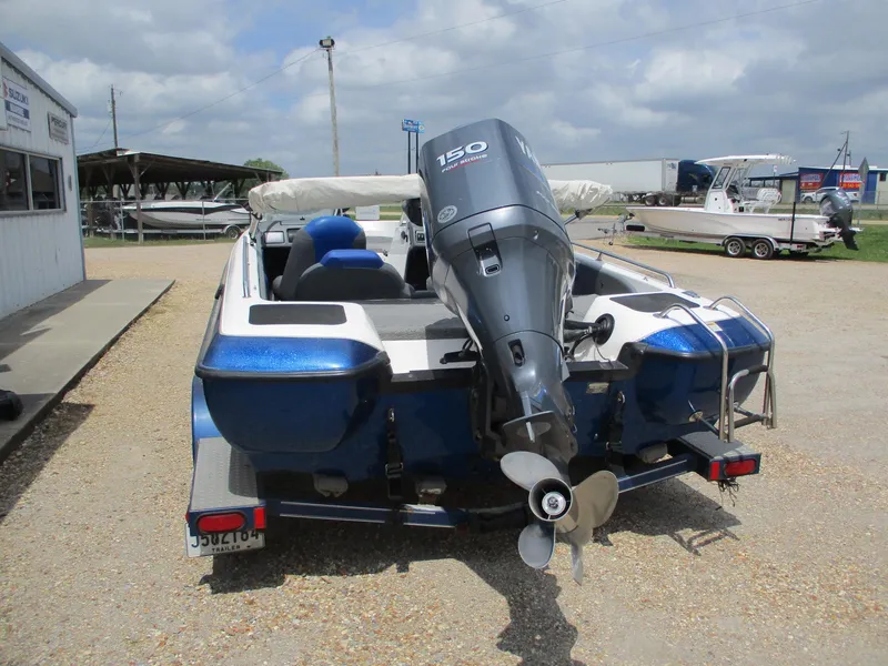 Slide: The Image of 2005 Skeeter SL 190 boat with Yamaha 150 outboard motor, parked on gravel. - 5