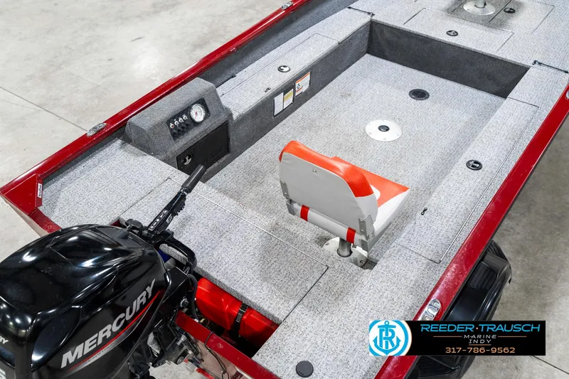 Slide: The Image of 2021 Tracker Super Guide 17 boat interior with Mercury engine and seating. - 12