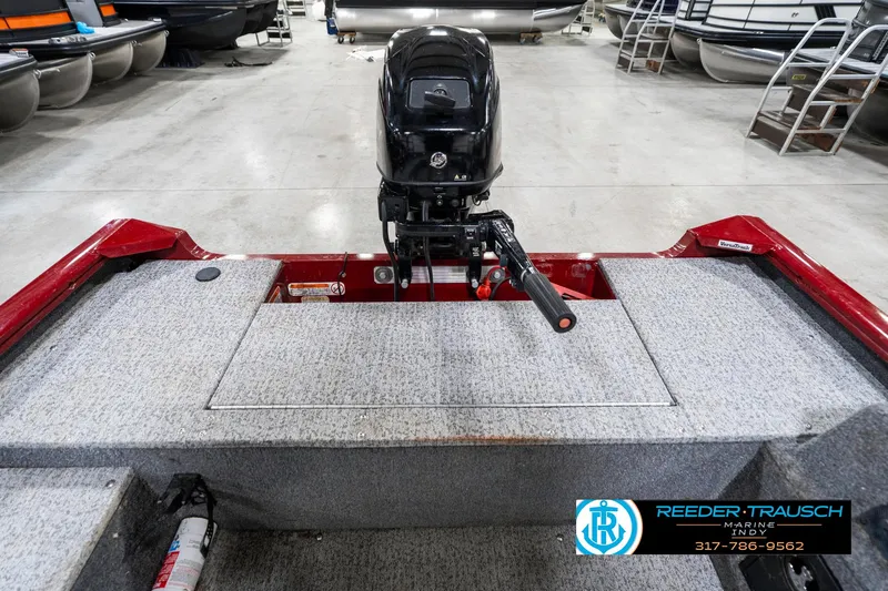 Slide: The Image of 2021 Tracker Super Guide 17 boat with outboard motor in showroom. - 19