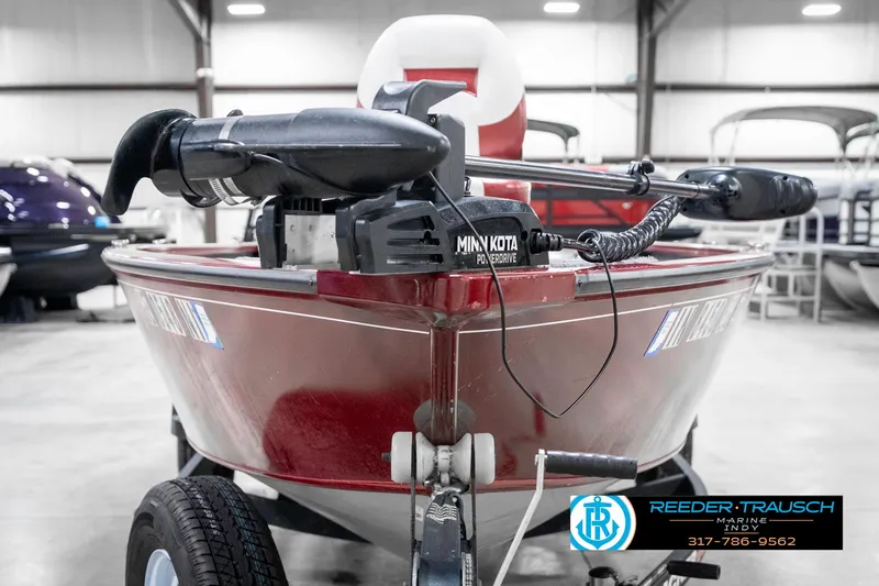 Slide: The Image of 2021 Tracker Super Guide 17 boat with Minn Kota motor in showroom. - 3