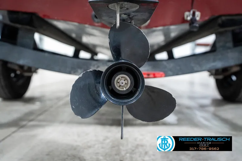 Slide: The Image of 2021 Tracker Super Guide 17 boat propeller close-up in a garage setting. - 38