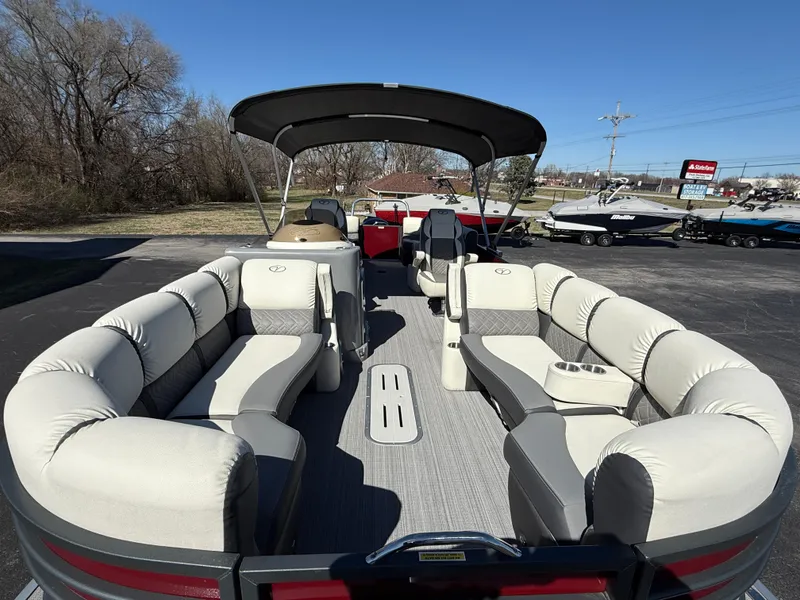 Slide: The Image of 2021 Veranda Relax VR22RC pontoon boat with spacious seating and canopy, parked outdoors. - 10