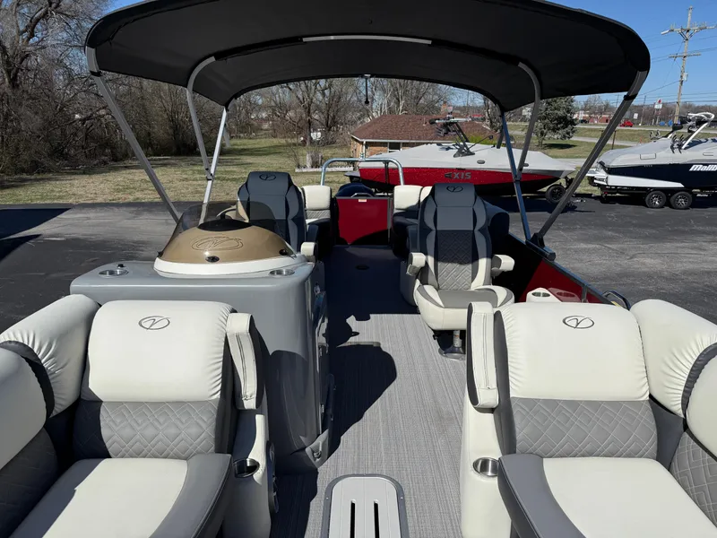 Slide: The Image of 2021 Veranda Relax VR22RC pontoon boat interior with plush seating and canopy. - 12
