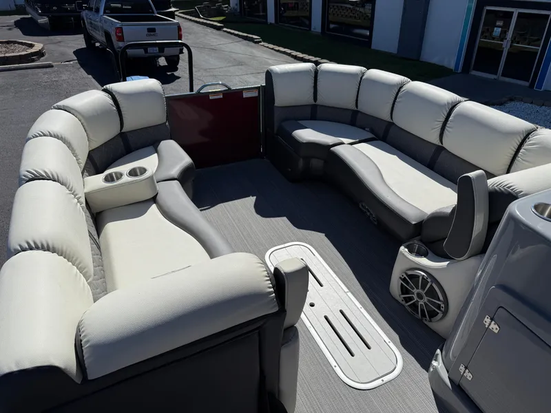 Slide: The Image of 2021 Veranda Relax VR22RC pontoon boat interior with plush seating and cup holders. - 13