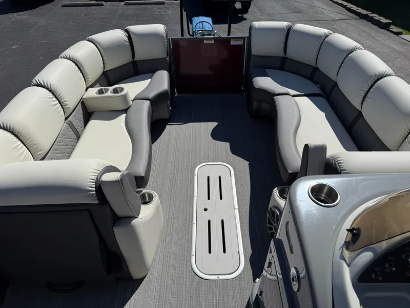 Slide: The Image of 2021 Veranda Relax VR22RC pontoon boat interior with plush seating and cup holders. - 14