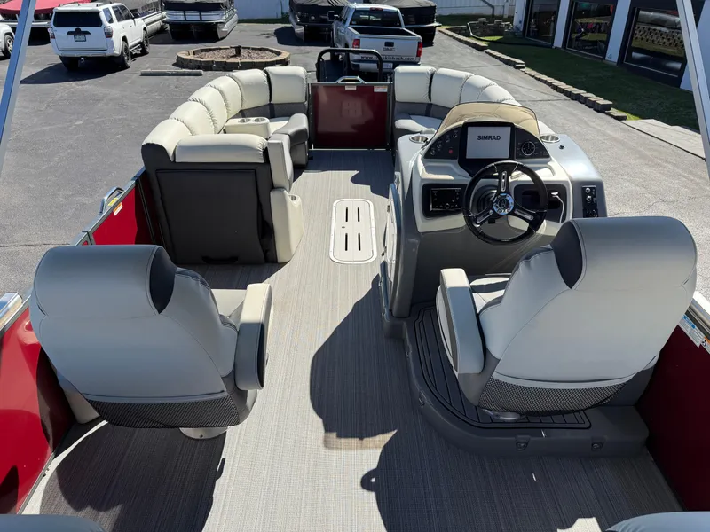 Slide: The Image of 2021 Veranda Relax VR22RC pontoon boat interior with plush seating and modern dashboard. - 15