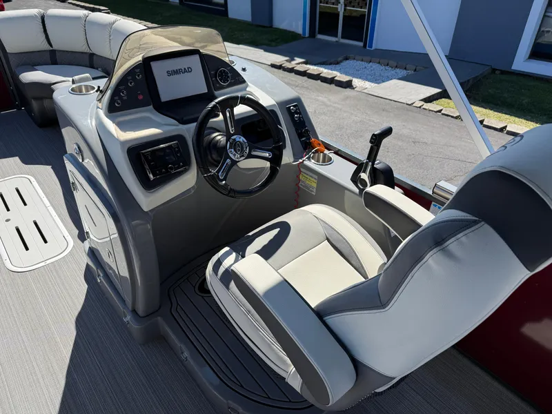 Slide: The Image of Captain's seat and helm of 2021 Veranda Relax VR22RC pontoon boat, featuring modern controls. - 19
