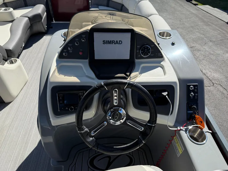 Slide: The Image of Steering console of 2021 Veranda Relax VR22RC boat with Simrad display and controls. - 20