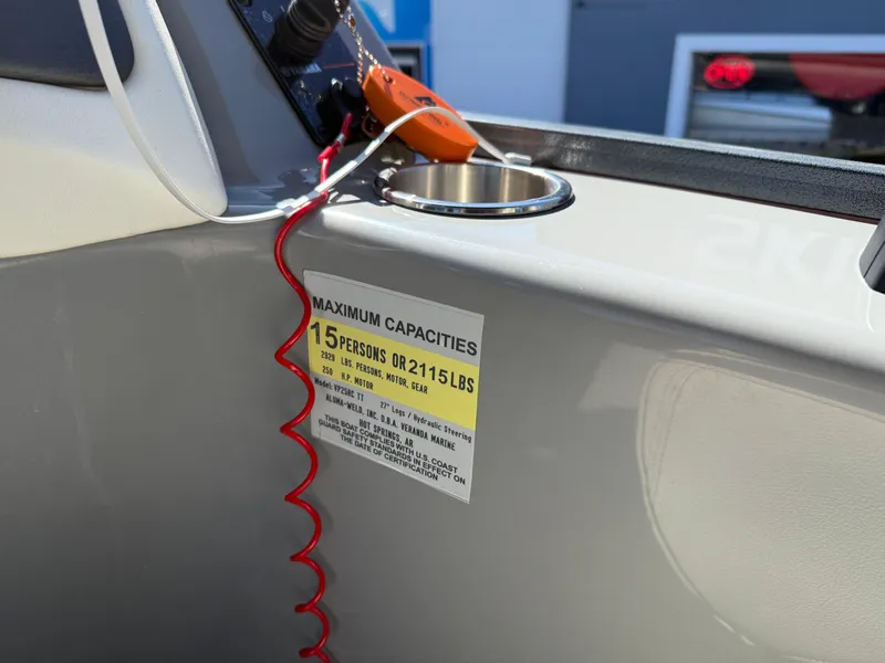 Slide: The Image of ```plaintext
Veranda Relax VR22RC 2021 boat capacity label, 15 persons or 2115 lbs, with safety equipment.
``` - 23