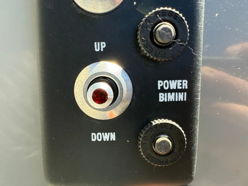 Slide: The Image of Control panel for Veranda Relax VR22RC 2021, featuring power bimini up and down buttons. - 27