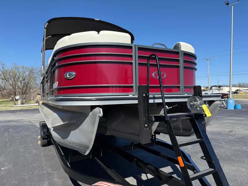 Slide: The Image of 2021 Veranda Relax VR22RC pontoon boat with red exterior on a trailer. - 4