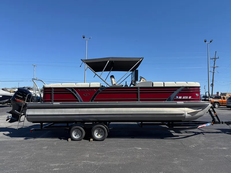 Slide: The Image of 2021 Veranda Relax VR22RC pontoon boat on trailer under clear blue sky. - 6