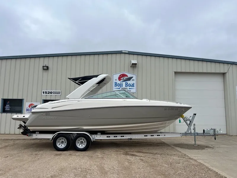 Slide: The Image of 2009 Monterey 254FS boat on trailer outside Boji Boat building. - 0