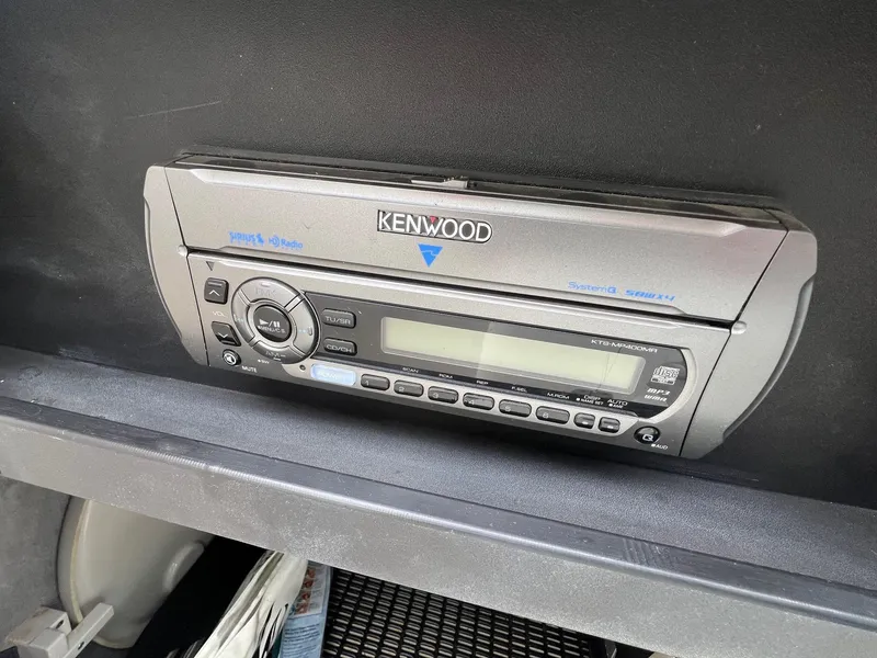 Slide: The Image of Kenwood stereo system in a 2009 Monterey 254FS boat dashboard. - 13