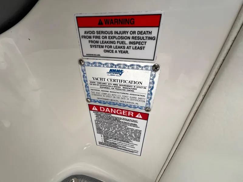 Slide: The Image of Warning and certification labels on a 2009 Monterey 254FS boat. - 19