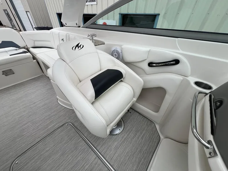 Slide: The Image of 2009 Monterey 254FS boat interior with white seating and modern design. - 21