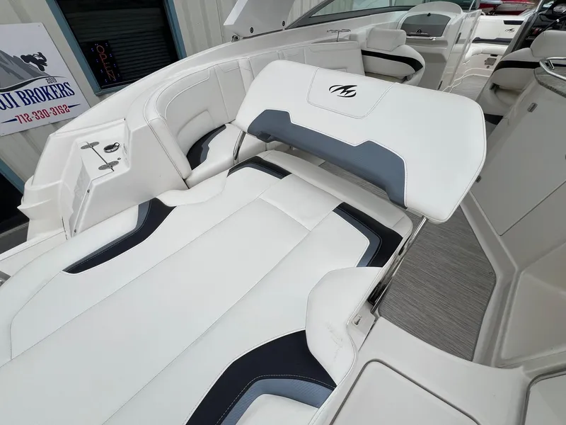 Slide: The Image of 2009 Monterey 254FS boat interior with white and gray seating, showcasing luxury design. - 29