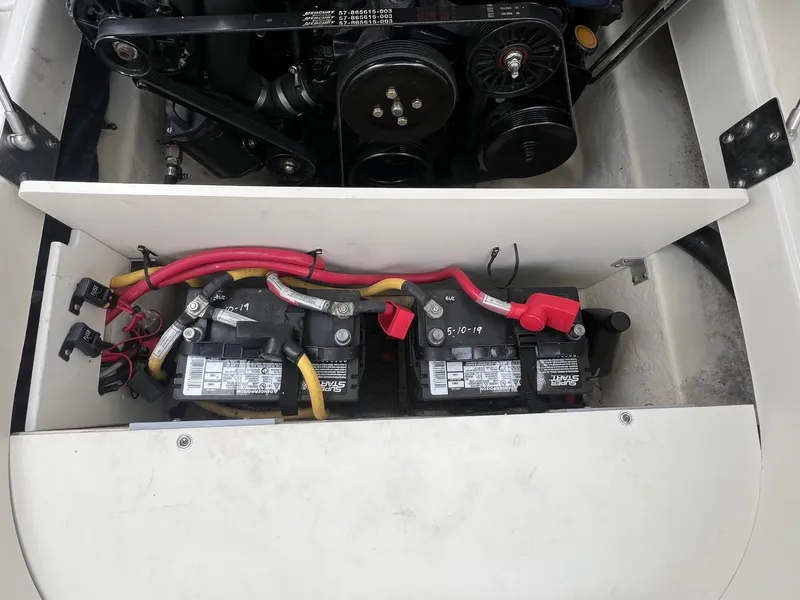Slide: The Image of 2009 Monterey 254FS boat engine compartment with dual batteries and wiring. - 31