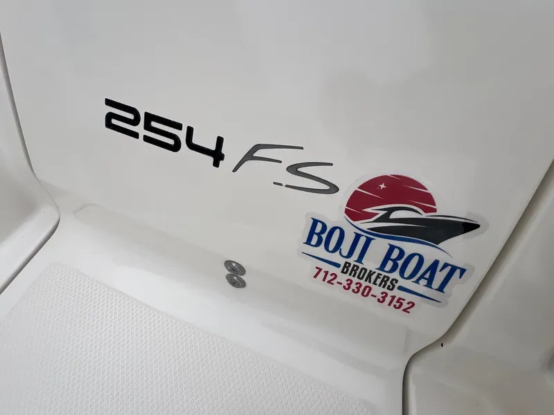Slide: The Image of 2009 Monterey 254FS boat with Boji Boat Brokers logo and contact number. - 35