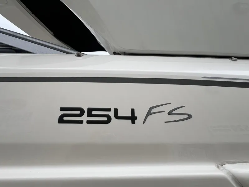 Slide: The Image of Close-up of 2009 Monterey 254FS boat model name on white hull. - 5