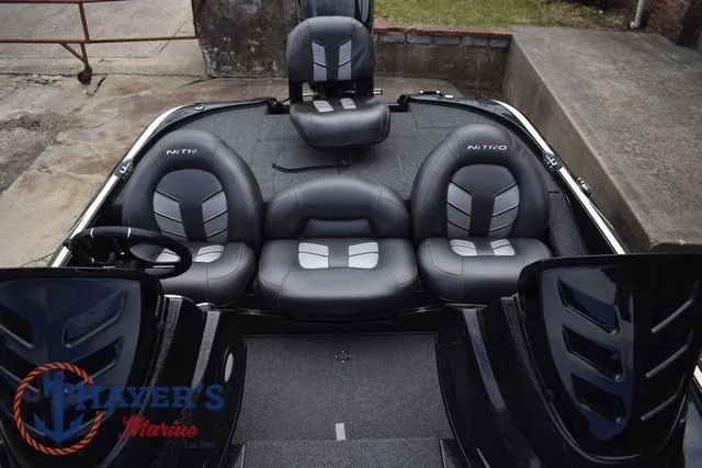 Slide: The Image of 2020 Nitro Z17 boat interior with black and gray seating, featuring Thayer's Marine logo. - 15
