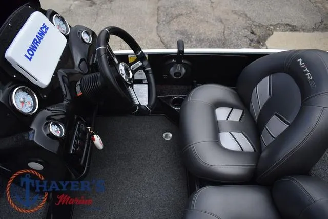 Slide: The Image of 2020 Nitro Z17 boat interior with steering wheel, gauges, and branded seating. - 16