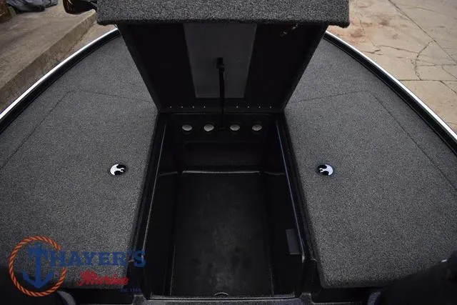 Slide: The Image of 2020 Nitro Z17 boat storage compartments with open hatch, gray carpeted interior. - 23