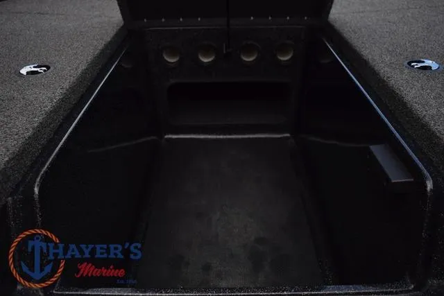 Slide: The Image of Open storage compartment of a 2020 Nitro Z17 boat, featuring carpeted interior. - 24